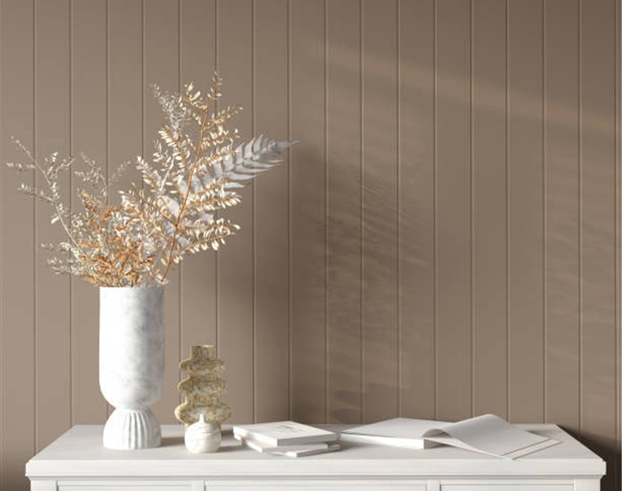 Vase with dried leaves on white table.