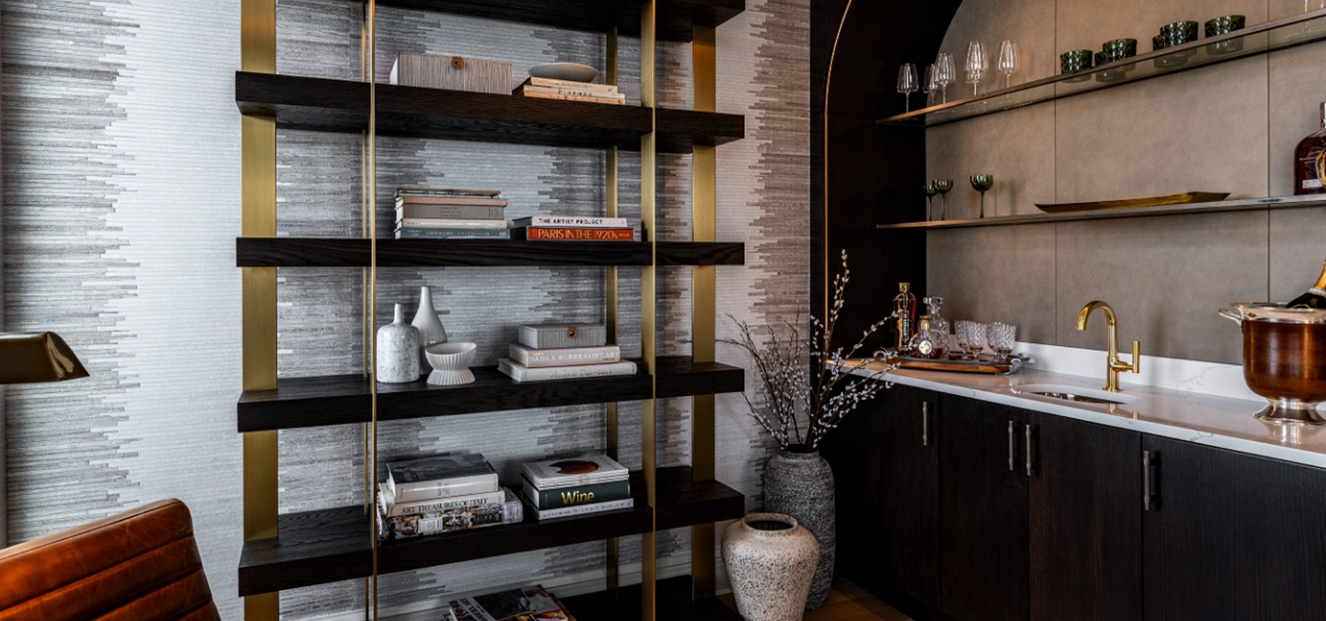 Kitchen with a bar and a chair in it